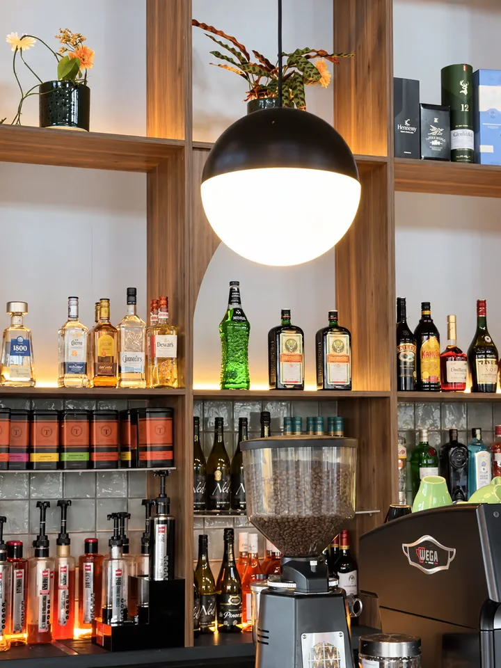 Bottles, flowers and coffee equipment on the Hood Street Bistro back bar
