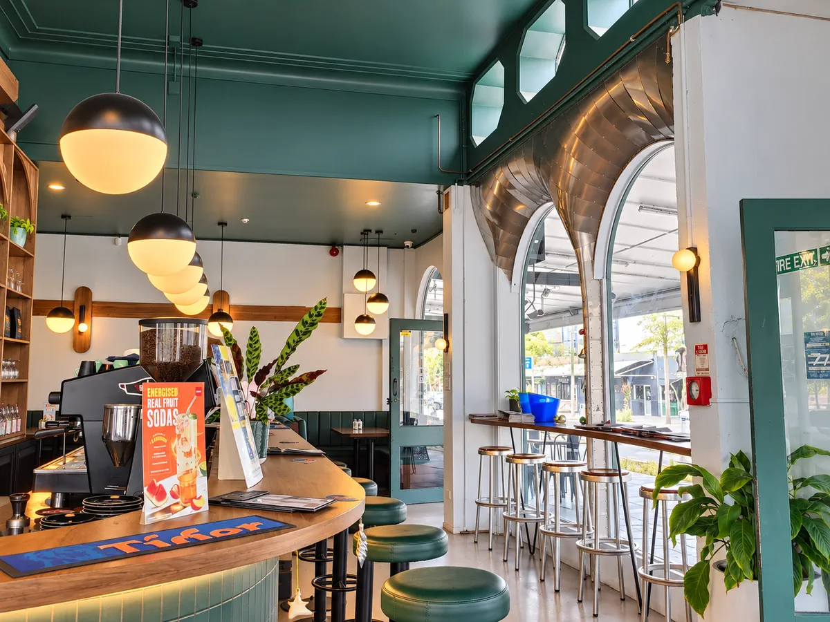 Window seating, hanging lights and the coffee bar inside Hood Street Bistro